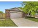 Inviting single-story home with a brick facade, two-car garage, and a meticulously kept lawn at 2209 S Flanders St, Aurora, CO 80013