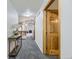 Hallway with carpet flooring and high ceiling leading to the living room at 2209 S Flanders St, Aurora, CO 80013