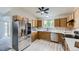 Updated kitchen featuring stainless steel appliances and light wood flooring at 2209 S Flanders St, Aurora, CO 80013