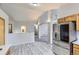 Open layout with a bright kitchen, stainless steel appliances, and light wood floors at 2209 S Flanders St, Aurora, CO 80013