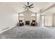 Expansive living area with high ceilings, carpet flooring, fireplace and plenty of natural light at 2209 S Flanders St, Aurora, CO 80013