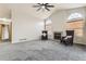 Inviting living room showcasing a fireplace, carpet flooring, high ceilings and natural light at 2209 S Flanders St, Aurora, CO 80013