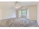 Spacious main bedroom with large windows and neutral-toned carpeting at 2209 S Flanders St, Aurora, CO 80013