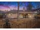 The backyard features a covered patio, a barbecue grill, a cozy swing, and ample seating areas for outdoor enjoyment at 16084 E Lehigh Cir, Aurora, CO 80013