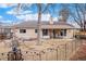 Backyard featuring a seating area, fire pit, covered patio, creating an inviting outdoor space at 16084 E Lehigh Cir, Aurora, CO 80013