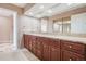 Bathroom with double sink vanity, granite countertop and plenty of cabinet space at 16084 E Lehigh Cir, Aurora, CO 80013