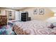 Bedroom view featuring an open closet, colorful rug and a comfortable bed at 16084 E Lehigh Cir, Aurora, CO 80013