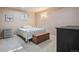 Bright bedroom with a comfy bed, bench, and storage, offering a relaxing retreat at 16084 E Lehigh Cir, Aurora, CO 80013
