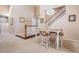 Dining area with stairs, light fixture, and room for four people to dine comfortably at 16084 E Lehigh Cir, Aurora, CO 80013