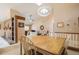 Bright dining room with vaulted ceiling, skylight, and fireplace, seamlessly connecting to the living area at 16084 E Lehigh Cir, Aurora, CO 80013