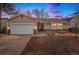Charming single-story home with a well-maintained front yard, attached garage, and covered entry way at 16084 E Lehigh Cir, Aurora, CO 80013