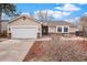 Charming single-story home featuring a two-car garage, cozy patio, and well-maintained landscaping at 16084 E Lehigh Cir, Aurora, CO 80013