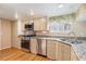 Modern kitchen featuring stainless steel appliances and granite countertops at 16084 E Lehigh Cir, Aurora, CO 80013
