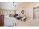 Bright living area featuring vaulted ceilings, neutral tones, and a sliding door to the backyard at 16084 E Lehigh Cir, Aurora, CO 80013