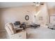 Elegant living space with vaulted ceiling, plush seating, and a contemporary design aesthetic at 16084 E Lehigh Cir, Aurora, CO 80013