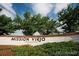 Community signage for Mission Viejo is displayed, surrounded by lush landscaping and greenery at 16084 E Lehigh Cir, Aurora, CO 80013