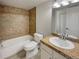 Clean bathroom with tiled shower/tub and granite vanity at 1723 Robb St # 31, Lakewood, CO 80215