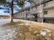 Apartment building exterior with landscaping and parking at 1723 Robb St # 31, Lakewood, CO 80215