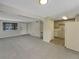 Open living room and kitchen with grey carpet and patio door at 1723 Robb St # 31, Lakewood, CO 80215