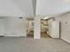 Bright living room with grey carpet and view into kitchen at 1723 Robb St # 31, Lakewood, CO 80215