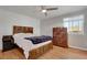 Cozy bedroom with wood flooring, a ceiling fan, and bright natural light at 5566 S Zinnia St, Littleton, CO 80127