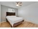 Neutral bedroom with wood floors, a ceiling fan, and ample natural light at 5566 S Zinnia St, Littleton, CO 80127