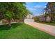 Single-Gathering home on a lush green lawn with mature trees and a two-car garage at 5566 S Zinnia St, Littleton, CO 80127