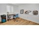 Well-lit office space featuring wood floors, a desk, and bright natural light at 5566 S Zinnia St, Littleton, CO 80127