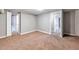 Bedroom featuring neutral carpet and multiple doorways offering easy access at 2607 E 14Th Ave, Denver, CO 80206