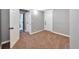 Bedroom with carpeted floors, gray walls, and multiple white doors at 2607 E 14Th Ave, Denver, CO 80206