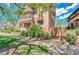 Beautiful brick apartment building featuring balconies and a well-maintained lawn at 2607 E 14Th Ave, Denver, CO 80206