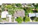 A high aerial view shows the property and neighboring street in a mature setting at 962 S Beech St, Lakewood, CO 80228