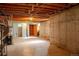 Unfinished basement with exposed ceiling and utilities; awaits customization and personalization at 962 S Beech St, Lakewood, CO 80228