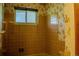 Bathroom featuring a vintage style shower, tiles, window, and fixtures at 962 S Beech St, Lakewood, CO 80228