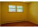 This light-filled bedroom features hardwood floors and a large window at 962 S Beech St, Lakewood, CO 80228