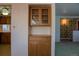 A charming built-in cabinet is featured between the kitchen and living spaces at 962 S Beech St, Lakewood, CO 80228