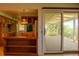 The kitchen offers a view to a covered patio at 962 S Beech St, Lakewood, CO 80228