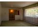 A spacious living room with large windows offers great natural light at 962 S Beech St, Lakewood, CO 80228