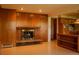 A spacious living room features a brick fireplace and hardwood floors at 962 S Beech St, Lakewood, CO 80228