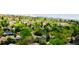 Scenic view of the neighborhood showcasing lush greenery, mature trees, and diverse housing options at 962 S Beech St, Lakewood, CO 80228