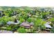 Picturesque neighborhood scene featuring homes surrounded by mature trees and green spaces, offering a serene living environment at 962 S Beech St, Lakewood, CO 80228