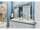 Modern bathroom with double vanity and shower/tub combo at 8885 S Tibet Ct, Aurora, CO 80016