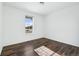 Bright bedroom with wood flooring and a large window at 8885 S Tibet Ct, Aurora, CO 80016