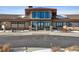 Elegant clubhouse entrance with seating and landscaping at 8885 S Tibet Ct, Aurora, CO 80016