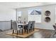 Bright dining room featuring a wooden table and gray chairs at 8885 S Tibet Ct, Aurora, CO 80016