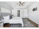 Main bedroom with king bed and access to the ensuite bathroom at 8885 S Tibet Ct, Aurora, CO 80016