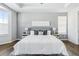 Main bedroom with a king-size bed and wood flooring at 8885 S Tibet Ct, Aurora, CO 80016