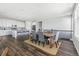 Open concept living and dining area with hardwood floors at 8885 S Tibet Ct, Aurora, CO 80016