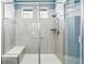 Large walk-in shower with a built-in seat at 8885 S Tibet Ct, Aurora, CO 80016