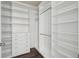 Large walk-in closet with ample shelving and hanging space at 8885 S Tibet Ct, Aurora, CO 80016